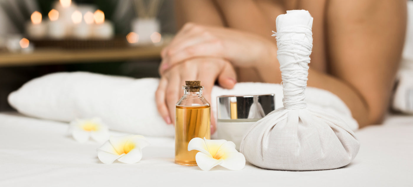 Oil Bottle On Table Next to Woman